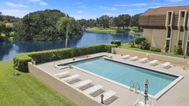 Welcome to this spacious 1st floor unit with covered parking on BallenIsles Golf and Country Club in Florida - for sale on GolfHomes.com, golf home, golf lot