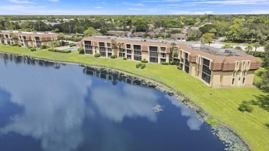 Welcome to this spacious 1st floor unit with covered parking on BallenIsles Golf and Country Club in Florida - for sale on GolfHomes.com, golf home, golf lot