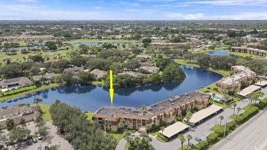 Welcome to this spacious 1st floor unit with covered parking on BallenIsles Golf and Country Club in Florida - for sale on GolfHomes.com, golf home, golf lot