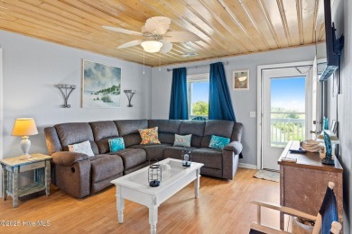 Charming ocean front cottage on the reserved island of Sunset on Oyster Bay Golf Links in North Carolina - for sale on GolfHomes.com, golf home, golf lot