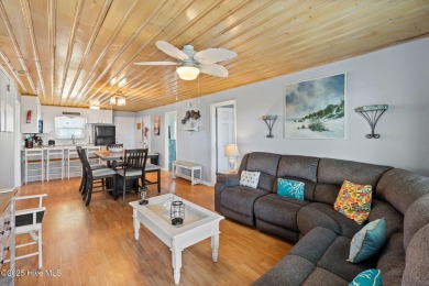 Charming ocean front cottage on the reserved island of Sunset on Oyster Bay Golf Links in North Carolina - for sale on GolfHomes.com, golf home, golf lot