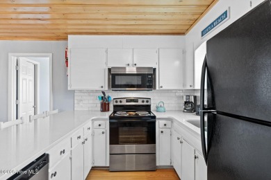 Charming ocean front cottage on the reserved island of Sunset on Oyster Bay Golf Links in North Carolina - for sale on GolfHomes.com, golf home, golf lot