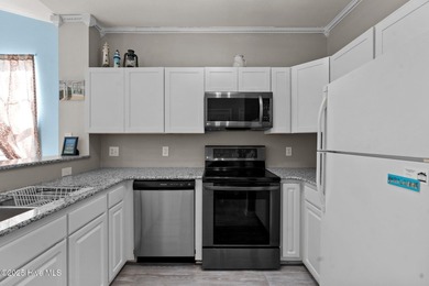 Start Your Summer in Sunset Beach! Furnished 2BR/2BA top-floor on Sandpiper Bay Golf and Country Club in North Carolina - for sale on GolfHomes.com, golf home, golf lot