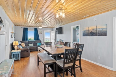 Charming ocean front cottage on the reserved island of Sunset on Oyster Bay Golf Links in North Carolina - for sale on GolfHomes.com, golf home, golf lot