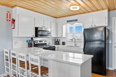 Charming ocean front cottage on the reserved island of Sunset on Oyster Bay Golf Links in North Carolina - for sale on GolfHomes.com, golf home, golf lot