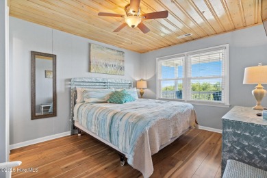 Charming ocean front cottage on the reserved island of Sunset on Oyster Bay Golf Links in North Carolina - for sale on GolfHomes.com, golf home, golf lot