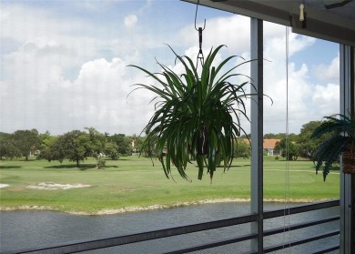 Highly sought-after *King* model with impact windows  accordion on Palm-Aire Country Club and Resort - Palms in Florida - for sale on GolfHomes.com, golf home, golf lot