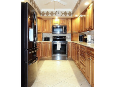 Highly sought-after *King* model with impact windows  accordion on Palm-Aire Country Club and Resort - Palms in Florida - for sale on GolfHomes.com, golf home, golf lot