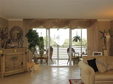 Highly sought-after *King* model with impact windows  accordion on Palm-Aire Country Club and Resort - Palms in Florida - for sale on GolfHomes.com, golf home, golf lot