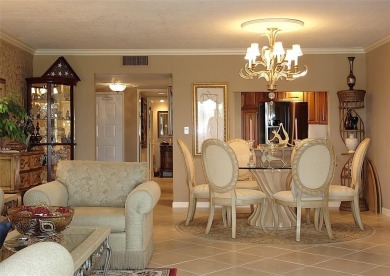Highly sought-after *King* model with impact windows  accordion on Palm-Aire Country Club and Resort - Palms in Florida - for sale on GolfHomes.com, golf home, golf lot