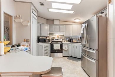Welcome to this beautifully maintained 2-bedroom, 2-bath home on Plantation Golf Club in Florida - for sale on GolfHomes.com, golf home, golf lot