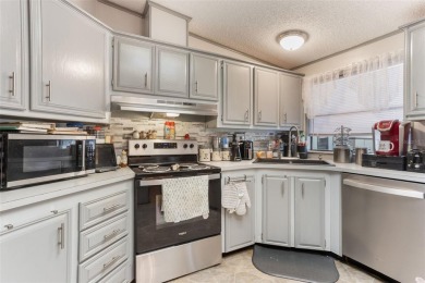 Welcome to this beautifully maintained 2-bedroom, 2-bath home on Plantation Golf Club in Florida - for sale on GolfHomes.com, golf home, golf lot