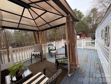 Welcome to lake living made easy in the highly sought-after on Old North State Club at Uwharrie Point Golf community in North Carolina - for sale on GolfHomes.com, golf home, golf lot