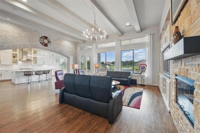 Situated directly on the 5th green, this luxury residence offers on Wildhorse Golf Club of Robson Ranch in Texas - for sale on GolfHomes.com, golf home, golf lot