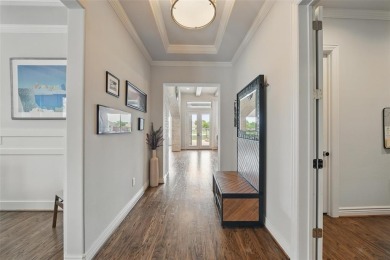 Situated directly on the 5th green, this luxury residence offers on Wildhorse Golf Club of Robson Ranch in Texas - for sale on GolfHomes.com, golf home, golf lot