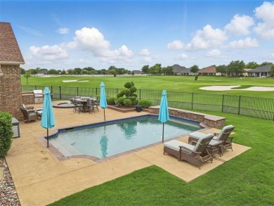 Situated directly on the 5th green, this luxury residence offers on Wildhorse Golf Club of Robson Ranch in Texas - for sale on GolfHomes.com, golf home, golf lot