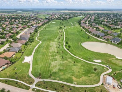 Situated directly on the 5th green, this luxury residence offers on Wildhorse Golf Club of Robson Ranch in Texas - for sale on GolfHomes.com, golf home, golf lot