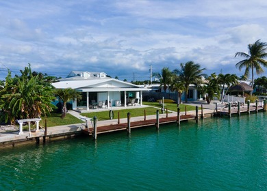 This waterfront half duplex is now available to purchase, or on Key Colony Beach Golf Course in Florida - for sale on GolfHomes.com, golf home, golf lot