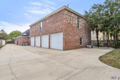 Welcome to this stunning two-story, 5-bedroom, 4.5-bath home on University Club in Louisiana - for sale on GolfHomes.com, golf home, golf lot