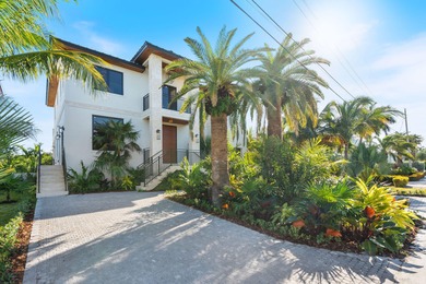 Brand new 2025 waterfront masterpiece. 5 bed, 4 bath, 3,580 sf on Key Colony Beach Golf Course in Florida - for sale on GolfHomes.com, golf home, golf lot