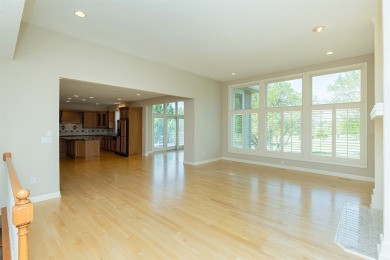 Enjoy luxury living in this stunning executive 1.5-story on Glen Oaks Country Club in Iowa - for sale on GolfHomes.com, golf home, golf lot
