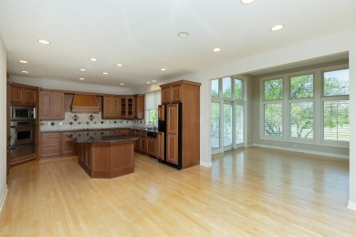 Enjoy luxury living in this stunning executive 1.5-story on Glen Oaks Country Club in Iowa - for sale on GolfHomes.com, golf home, golf lot