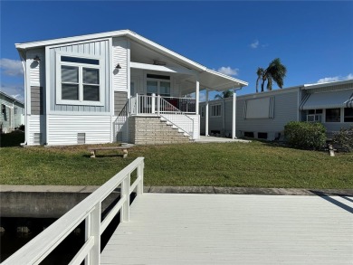 WATERFRONT living at its finest! HIGH & DRY!!! This lovely 2 on Mangrove Bay Golf Course in Florida - for sale on GolfHomes.com, golf home, golf lot