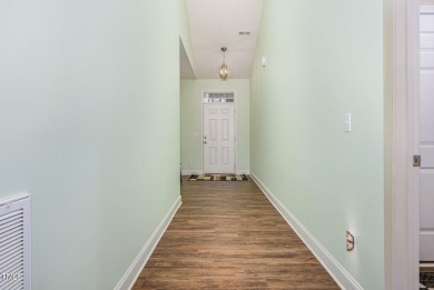 Welcome to this beautiful 1.5 story ranch home in the desirable on Olde Liberty Golf and Country Club in North Carolina - for sale on GolfHomes.com, golf home, golf lot