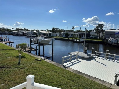 WATERFRONT living at its finest! HIGH & DRY!!! This lovely 2 on Mangrove Bay Golf Course in Florida - for sale on GolfHomes.com, golf home, golf lot