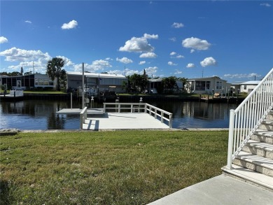 WATERFRONT living at its finest! HIGH & DRY!!! This lovely 2 on Mangrove Bay Golf Course in Florida - for sale on GolfHomes.com, golf home, golf lot