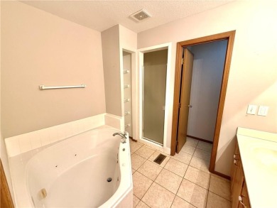 This spacious half-duplex in Golf View Villas features both on Teetering Rocks Links in Missouri - for sale on GolfHomes.com, golf home, golf lot