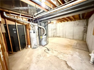This spacious half-duplex in Golf View Villas features both on Teetering Rocks Links in Missouri - for sale on GolfHomes.com, golf home, golf lot