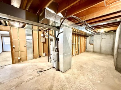 This spacious half-duplex in Golf View Villas features both on Teetering Rocks Links in Missouri - for sale on GolfHomes.com, golf home, golf lot