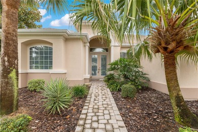 Luxurious Hampton model boasts French glass double French doors on Eagle Ridge At Spruce Creek Country Club in Florida - for sale on GolfHomes.com, golf home, golf lot