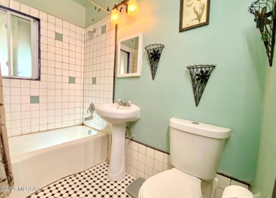 This charming solid brick home sits on a coveted 0.30-acre on Randolph Park Golf Courses in Arizona - for sale on GolfHomes.com, golf home, golf lot