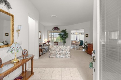 Luxurious Hampton model boasts French glass double French doors on Eagle Ridge At Spruce Creek Country Club in Florida - for sale on GolfHomes.com, golf home, golf lot