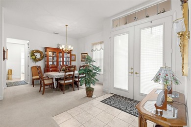 Luxurious Hampton model boasts French glass double French doors on Eagle Ridge At Spruce Creek Country Club in Florida - for sale on GolfHomes.com, golf home, golf lot