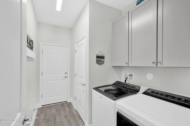 Beautiful Turn-Key Camellia Cottage offering 2 bedrooms, 2 baths on LPGA International Golf Course in Florida - for sale on GolfHomes.com, golf home, golf lot