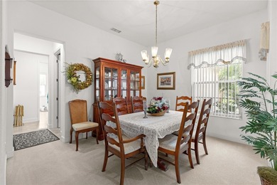 Luxurious Hampton model boasts French glass double French doors on Eagle Ridge At Spruce Creek Country Club in Florida - for sale on GolfHomes.com, golf home, golf lot