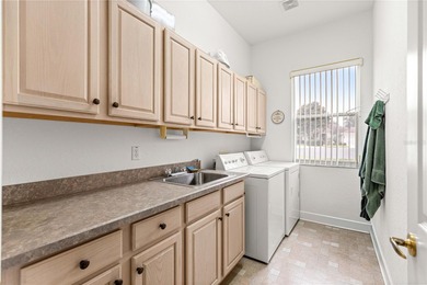 Luxurious Hampton model boasts French glass double French doors on Eagle Ridge At Spruce Creek Country Club in Florida - for sale on GolfHomes.com, golf home, golf lot