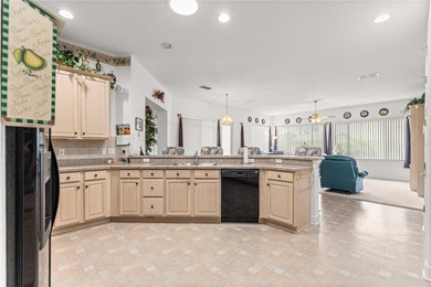 Luxurious Hampton model boasts French glass double French doors on Eagle Ridge At Spruce Creek Country Club in Florida - for sale on GolfHomes.com, golf home, golf lot
