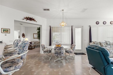 Luxurious Hampton model boasts French glass double French doors on Eagle Ridge At Spruce Creek Country Club in Florida - for sale on GolfHomes.com, golf home, golf lot