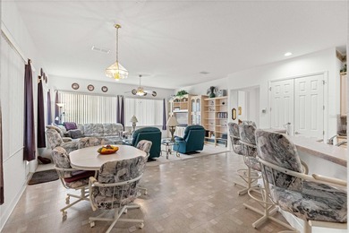 Luxurious Hampton model boasts French glass double French doors on Eagle Ridge At Spruce Creek Country Club in Florida - for sale on GolfHomes.com, golf home, golf lot