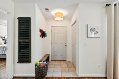Welcome to this exceptional end-unit first-floor condominium on Carolina National Golf Club in North Carolina - for sale on GolfHomes.com, golf home, golf lot