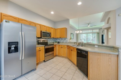 This beautifully maintained 2-bedroom, 2-bathroom single-level on LPGA International Golf Course in Florida - for sale on GolfHomes.com, golf home, golf lot