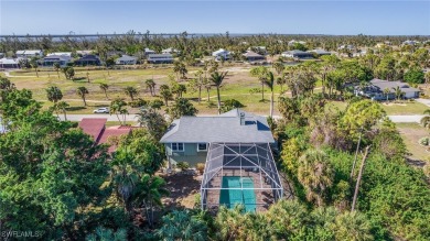 Welcome to 14148 Sandarac Dr, Bokeelia, FL--a beautifully on Alden Pines Golf Club in Florida - for sale on GolfHomes.com, golf home, golf lot