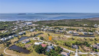 Welcome to 14148 Sandarac Dr, Bokeelia, FL--a beautifully on Alden Pines Golf Club in Florida - for sale on GolfHomes.com, golf home, golf lot