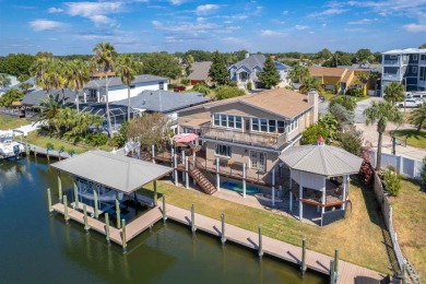 This waterfront home is situated on a canal in the desired on Tiger Point Golf and Country Club in Florida - for sale on GolfHomes.com, golf home, golf lot