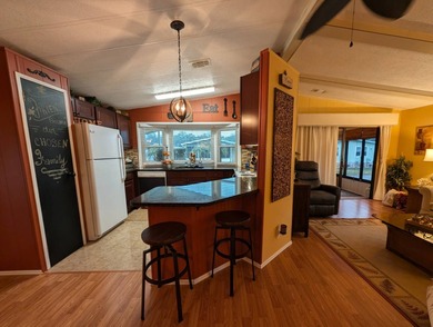 Experience the pinnacle of 55+ living in this impeccably on Grasslands Golf and Country Club in Florida - for sale on GolfHomes.com, golf home, golf lot