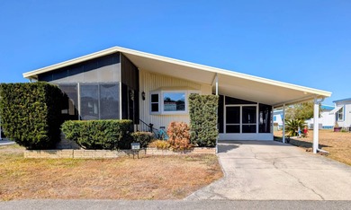 Experience the pinnacle of 55+ living in this impeccably on Grasslands Golf and Country Club in Florida - for sale on GolfHomes.com, golf home, golf lot
